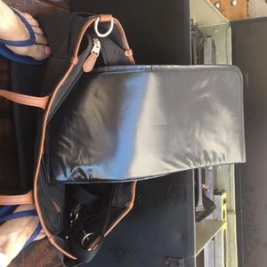 A black coach tote diaper bag